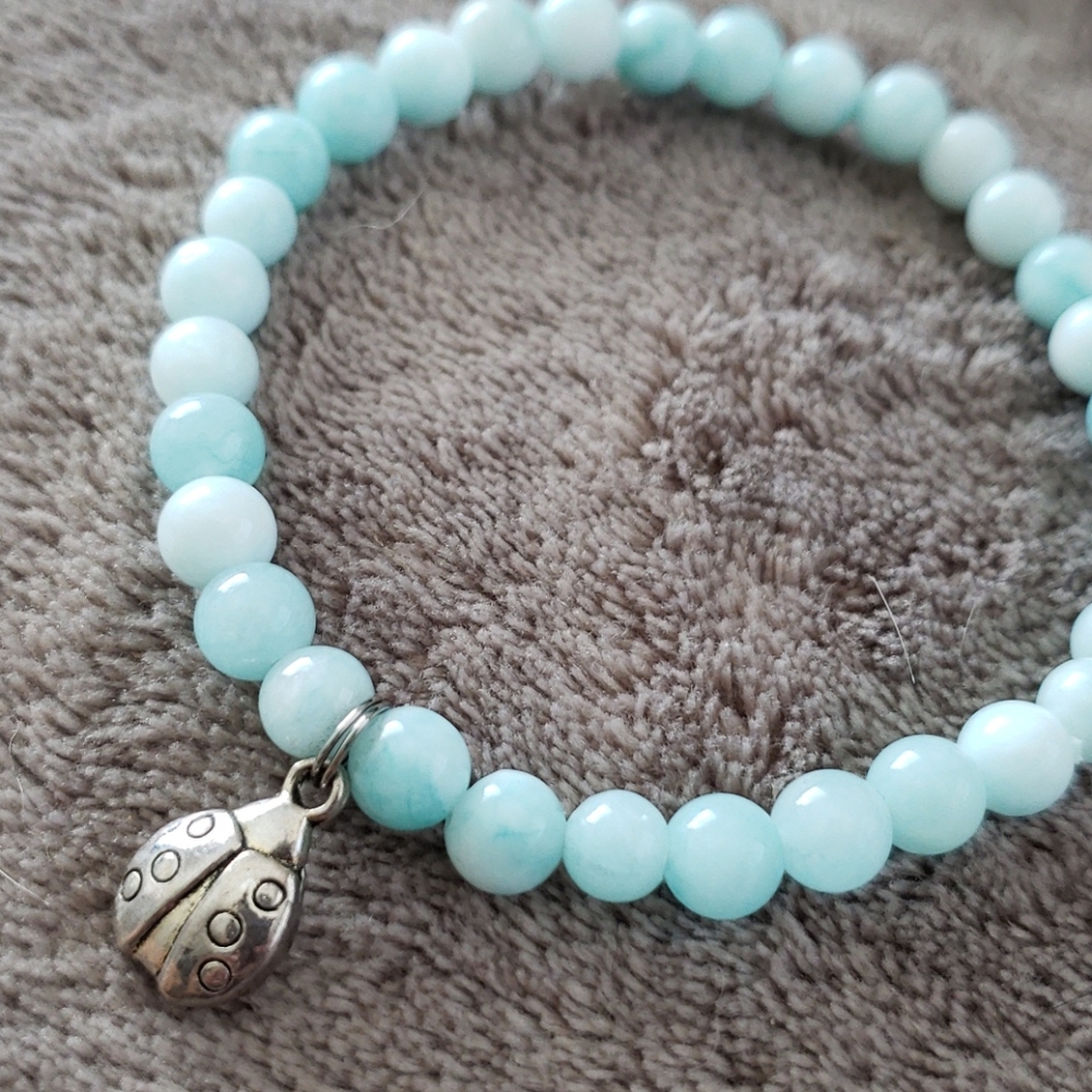 Turquoise beaded bracelet ladybug charm